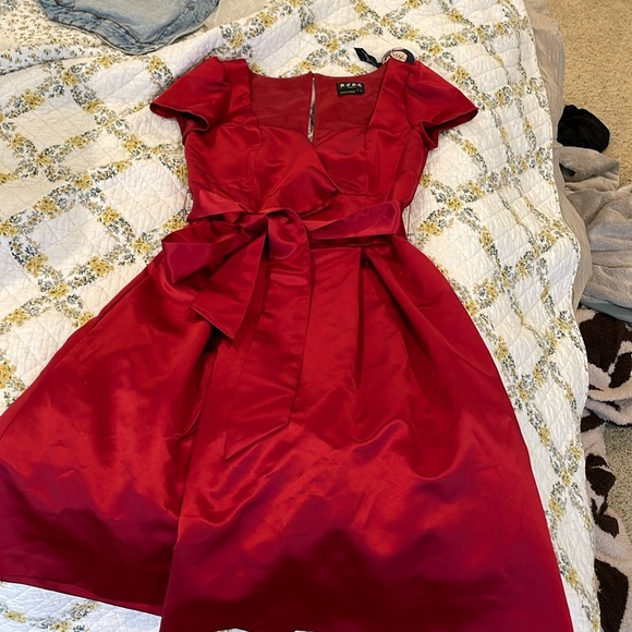 This is a gorgeous satin red dress. It’s a size 4. - Picture 1 of 4
